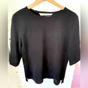 Black ribbed blouse by boutique designer Ulla Surland